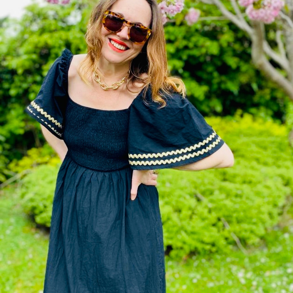 Black dress with gold trim hotsell